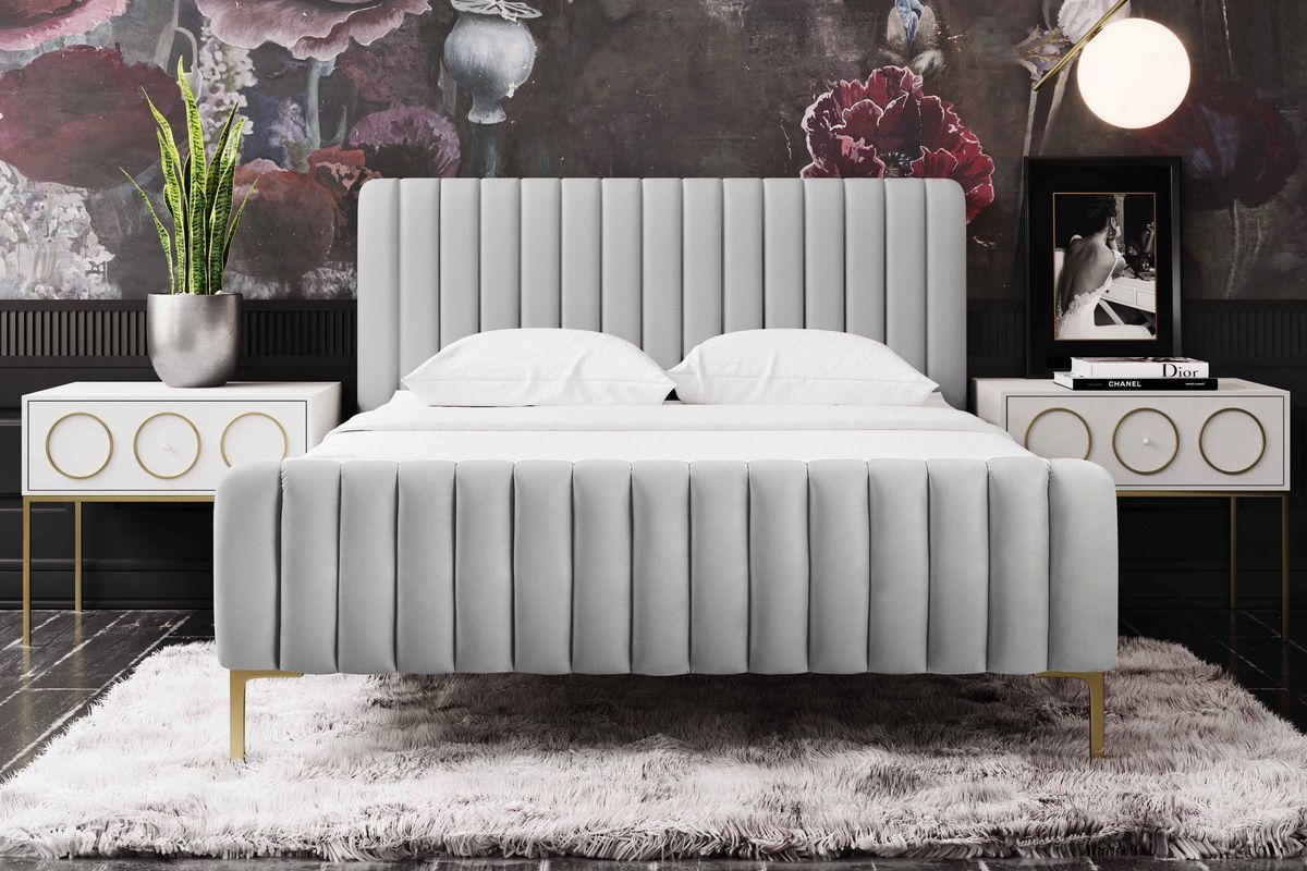 Grey velvet bed with plush channel tufting with gold legs